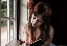 Some Day I Will be Someone’s Ancestor Sad woman writing in her jounal by the window could be someone's ancestor one day